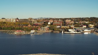 5.7K aerial stock footage of orbiting city buildings near marinas, seen from breakwater, Burlington, Vermont Aerial Stock Footage | DX0002_224_059