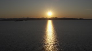 5.7K aerial stock footage setting sun reflecting off the surface of Lake Champlain, Burlington, Vermont Aerial Stock Footage | DX0002_225_002