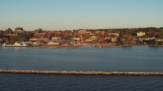 5.7K aerial stock footage fly over breakwater toward a marina and downtown, Burlington, Vermont Aerial Stock Footage | DX0002_225_003