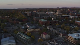 5.7K aerial stock footage descend while focused on downtown office buildings at sunset, Burlington, Vermont Aerial Stock Footage | DX0002_225_024