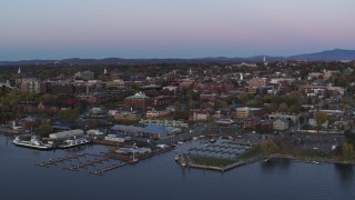 5.7K aerial stock footage of orbiting downtown buildings at twilight, reveal marina, Burlington, Vermont Aerial Stock Footage | DX0002_225_028