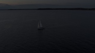 5.7K aerial stock footage of a sailboat on Lake Champlain at twilight, Burlington, Vermont Aerial Stock Footage | DX0002_225_035