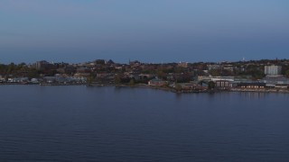 5.7K aerial stock footage slowly approach downtown buildings from the lake at twilight, Burlington, Vermont Aerial Stock Footage | DX0002_225_037