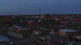 5.7K aerial stock footage of focusing on downtown area office buildings during descent at twilight, Burlington, Vermont Aerial Stock Footage | DX0002_225_048