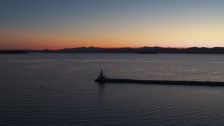 5.7K aerial stock footage stationary view of Lake Champlain lighthouse at twilight, Burlington, Vermont Aerial Stock Footage | DX0002_226_004