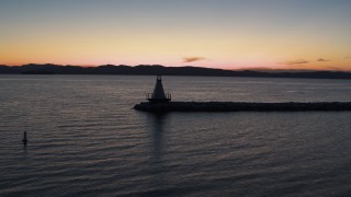 DX0002_226_005 - 5.7K aerial stock footage of orbiting a Lake Champlain lighthouse at twilight, Burlington, Vermont