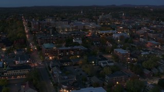 5.7K aerial stock footage circle and fly away from downtown area office buildings at twilight, Burlington, Vermont Aerial Stock Footage | DX0002_226_013