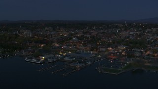 5.7K aerial stock footage a stationary view of city's downtown area and a marina at night, Burlington, Vermont Aerial Stock Footage | DX0002_226_019