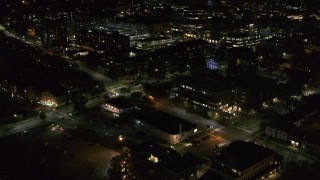 5.7K aerial stock footage orbit office buildings on Battery Street lit up for nighttime, Burlington, Vermont Aerial Stock Footage | DX0002_226_037