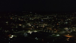 5.7K aerial stock footage of slowly orbiting office buildings in downtown lit up for nighttime, Burlington, Vermont Aerial Stock Footage | DX0002_226_040