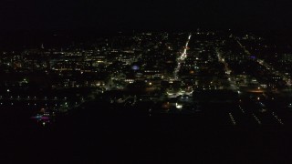 5.7K aerial stock footage of orbiting buildings and streets in downtown lit up for nighttime, Burlington, Vermont Aerial Stock Footage | DX0002_226_043