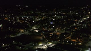 DX0002_226_047 - 5.7K aerial stock footage of flying around downtown office buildings at nighttime, Burlington, Vermont