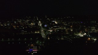 5.7K aerial stock footage of a view of city buildings in downtown at night, Burlington, Vermont Aerial Stock Footage | DX0002_226_049