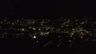 5.7K aerial stock footage of the downtown area at night, seen from marinas, Burlington, Vermont Aerial Stock Footage | DX0002_226_059