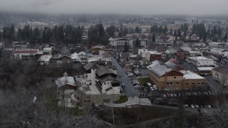 5.7K aerial stock footage orbit rooftops dusted with snow in the small town, Leavenworth, Washington Aerial Stock Footage | DX0002_227_010