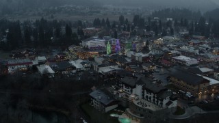 5.7K aerial stock footage descend and circle town while focused on Christmas trees, Leavenworth, Washington Aerial Stock Footage | DX0002_227_042