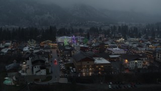 5.7K aerial stock footage orbiting a small town decorated with Christmas trees and lights, Leavenworth, Washington Aerial Stock Footage | DX0002_227_051