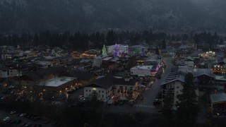 5.7K aerial stock footage of a small town decorated with Christmas trees and lights, Leavenworth, Washington Aerial Stock Footage | DX0002_227_053