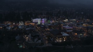 5.7K aerial stock footage of circling a small town with Christmas trees and lights at twilight, Leavenworth, Washington Aerial Stock Footage | DX0002_228_002