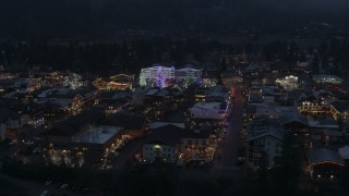 5.7K aerial stock footage of flying around a small town with Christmas trees and lights at twilight, Leavenworth, Washington Aerial Stock Footage | DX0002_228_004