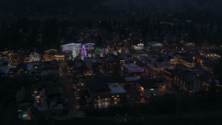 5.7K aerial stock footage of flying around Christmas trees and lights at night in Leavenworth, Washington Aerial Stock Footage | DX0002_228_010