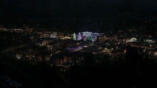 5.7K aerial stock footage of trees and buildings with Christmas lights at night, Leavenworth, Washington Aerial Stock Footage | DX0002_228_027