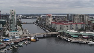 5.7K aerial stock footage reverse view of condo complexes by a channel in Tampa, Florida Aerial Stock Footage | DX0003_229_028