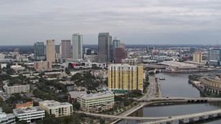 DX0003_229_032 - 5.7K aerial stock footage flying by bridges with view of Downtown Tampa, Florida