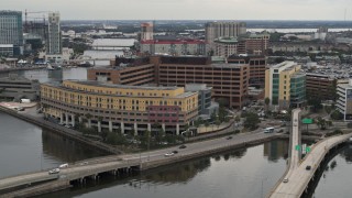 5.7K aerial stock footage a reverse view of a waterfront hospital in Tampa, Florida Aerial Stock Footage | DX0003_230_003