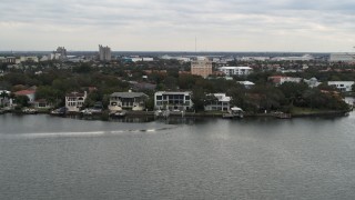 5.7K aerial stock footage of flying by waterfront mansions in Tampa, Florida Aerial Stock Footage | DX0003_230_016