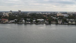 5.7K aerial stock footage of passing by waterfront mansions in Tampa, Florida Aerial Stock Footage | DX0003_230_017