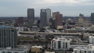 DX0003_230_025 - 5.7K aerial stock footage of passing by skyscrapers in the downtown skyline, Downtown Tampa, Florida