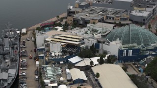 5.7K aerial stock footage reverse view of a warship museum and aquarium in Tampa, Florida Aerial Stock Footage | DX0003_230_030