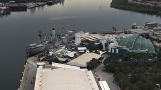 5.7K aerial stock footage of circling a warship museum and aquarium in Tampa, Florida Aerial Stock Footage | DX0003_230_033