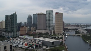 5.7K aerial stock footage reverse view of skyscrapers by the river during descent, Downtown Tampa, Florida Aerial Stock Footage | DX0003_231_017