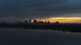 DX0003_231_041 - 5.7K aerial stock footage wide view of the distant city skyline of Downtown Tampa, Florida at sunset