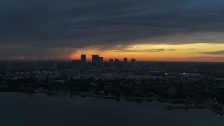 5.7K aerial stock footage of the distant city skyline of Downtown Tampa, Florida at sunset Aerial Stock Footage | DX0003_231_042