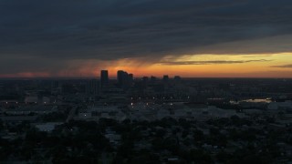 5.7K aerial stock footage a reverse view of the Downtown Tampa skyline at sunset, Florida Aerial Stock Footage | DX0003_231_048