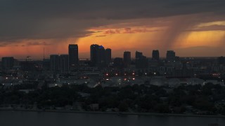 5.7K aerial stock footage ascend while flying by the Downtown Tampa skyline at twilight, Florida Aerial Stock Footage | DX0003_232_004