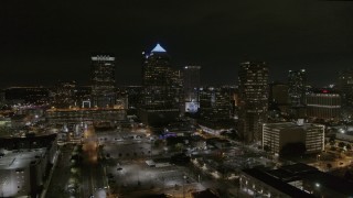 5.7K aerial stock footage orbit and fly away from skyscrapers at night in Downtown Tampa, Florida Aerial Stock Footage | DX0003_232_027