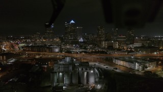 DX0003_232_028 - 5.7K aerial stock footage fly away from skyscrapers at night in Downtown Tampa, Florida