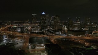 DX0003_232_032 - 5.7K aerial stock footage a stationary view of skyscrapers at night in Downtown Tampa, Florida