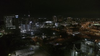 DX0003_232_042 - 5.7K aerial stock footage orbit and approach Amalie Arena at night in Downtown Tampa, Florida