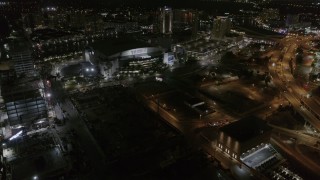 5.7K aerial stock footage of slowly flying away from Amalie Arena at night in Downtown Tampa, Florida Aerial Stock Footage | DX0003_232_045