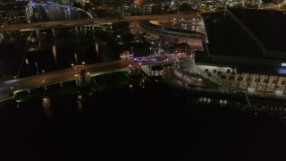 5.7K aerial stock footage approach police cars on the bridge by convention center at night in Downtown Tampa, Florida Aerial Stock Footage | DX0003_232_050