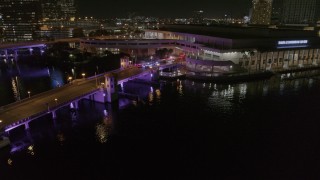 5.7K aerial stock footage orbit police cars on a bridge by convention center at night in Downtown Tampa, Florida Aerial Stock Footage | DX0003_232_054