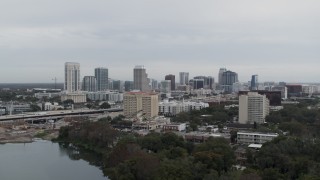 5.7K aerial stock footage of ascending toward the city's skyline, Downtown Orlando, Florida Aerial Stock Footage | DX0003_233_001