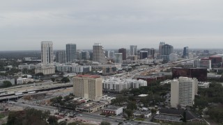 5.7K aerial stock footage of a reverse view of the city's skyline, Downtown Orlando, Florida Aerial Stock Footage | DX0003_233_002