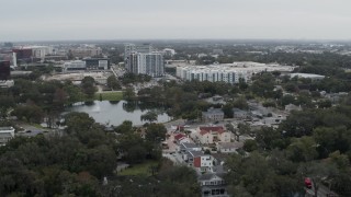 5.7K aerial stock footage of Lake Dot and apartment buildings in Orlando, Florida Aerial Stock Footage | DX0003_233_016