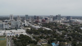 5.7K aerial stock footage of flying by the skyline of Downtown Orlando, Florida Aerial Stock Footage | DX0003_233_052